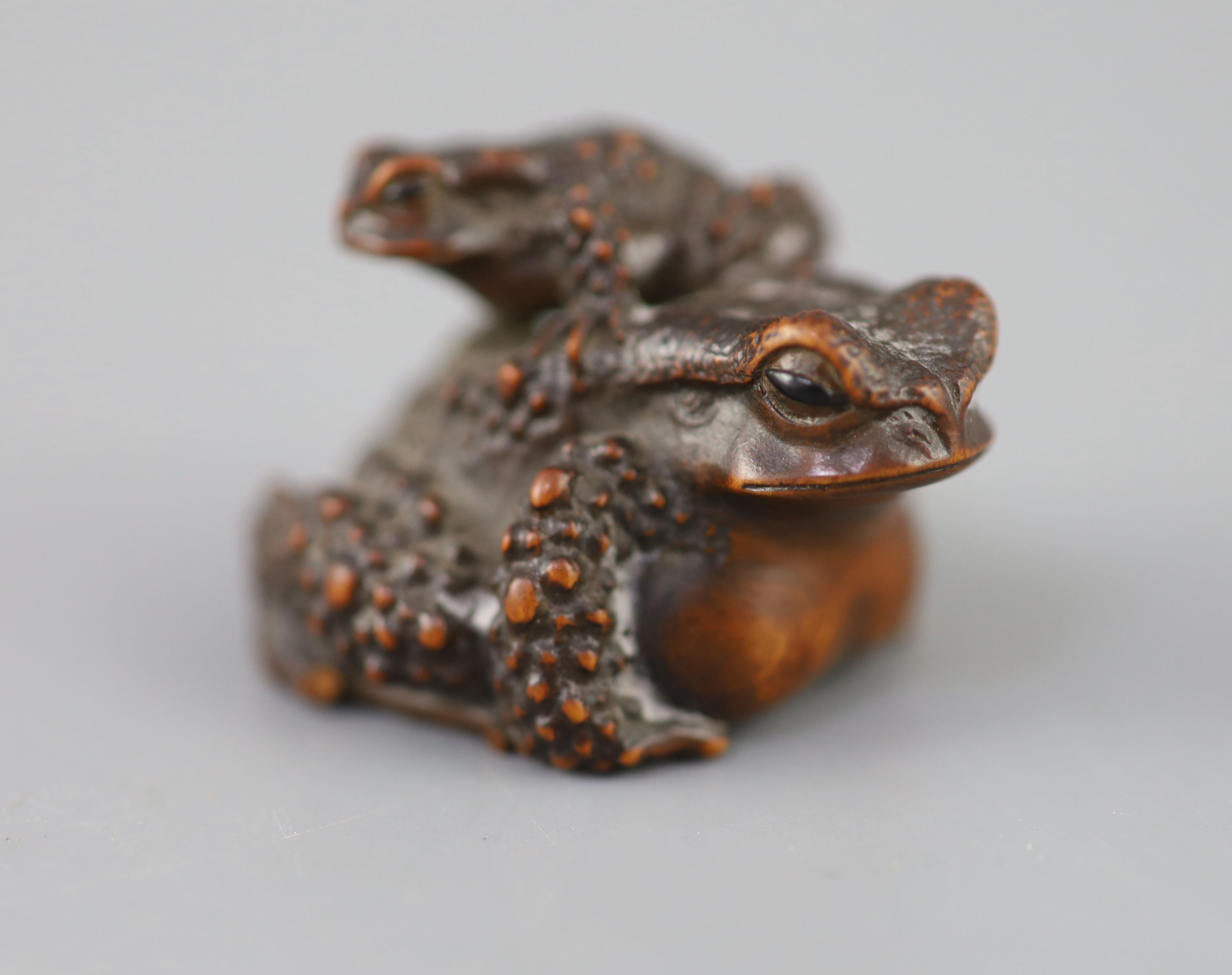 A fine Japanese wood okimono of toads, signed Masanao, 19th century,